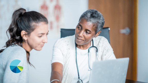 A direct primary care doctor and patient sitting together